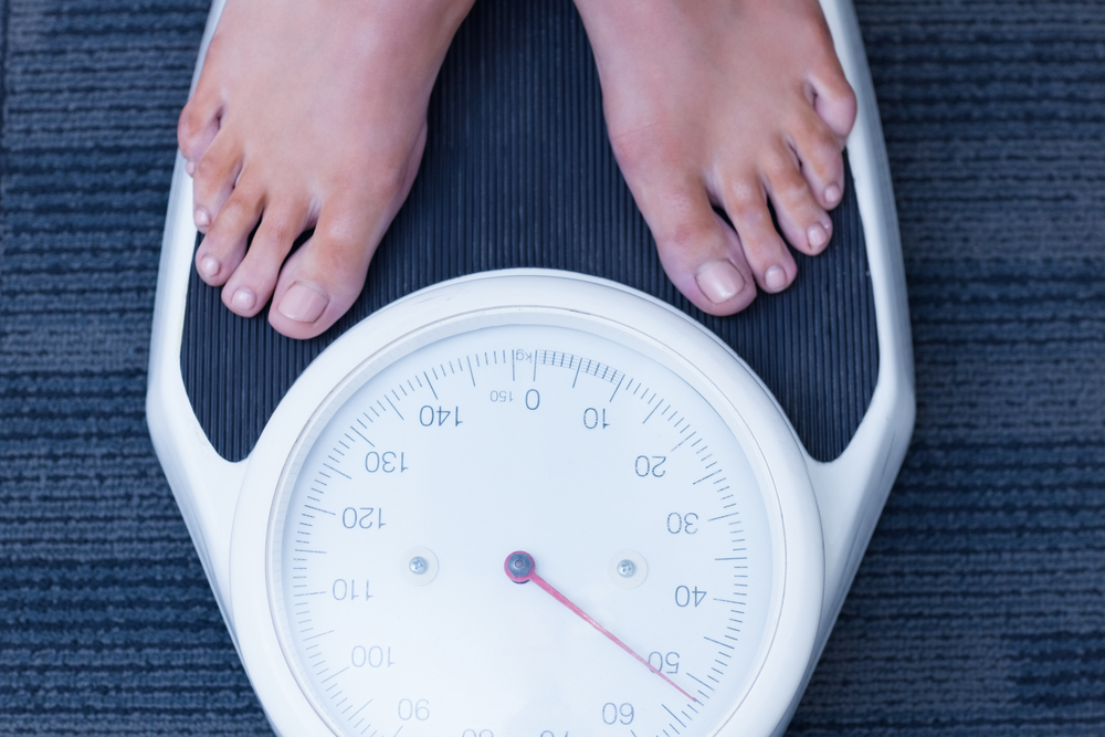 Close up of a woman standing on the scales in hospital