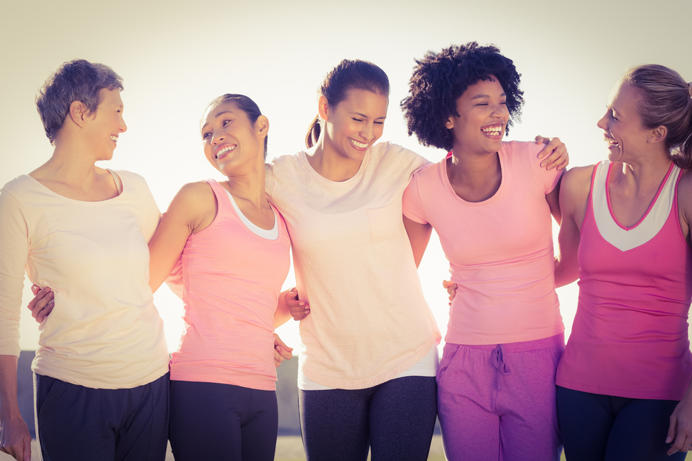 Laughing women wearing pink for breast cancer in parkland-1